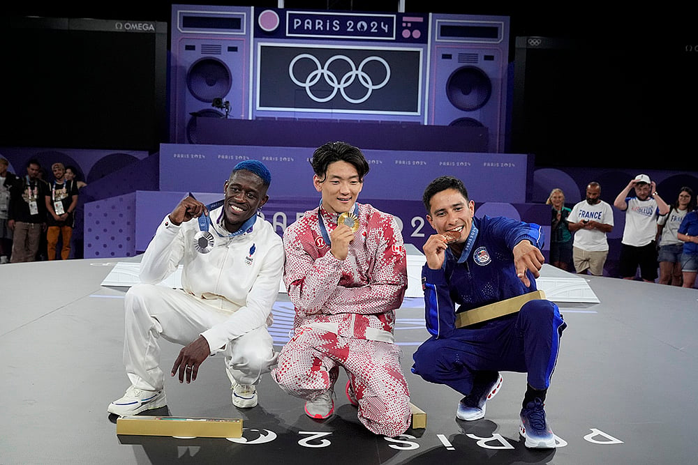 | Photo: AP/Frank Franklin : Paris Olympic Breaking B-Boys: Gold medallist Canada's Philip Kim, center, with silver medallist France's Danis Civil, left, and bronze medallist United States Victor Mantalvo
